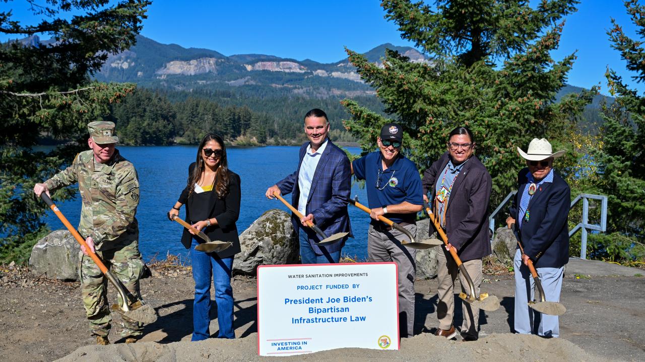 Assistant Secretary for Indian Affairs Bryan Newland, center, is joined by leaders from the Columbia River Inter-Tribal Fish Commission and other federal officials at a groundbreaking event for new water and sewer system upgrades at the Cascade Locks Treaty In-Lieu site in Oregon on Oct. 1, 2024. During the event, Newland announced a new investment of nearly $10 million from President Biden’s Investing in America agenda to provide critical rehabilitation at Tribal fishing sites along the Columbia River.