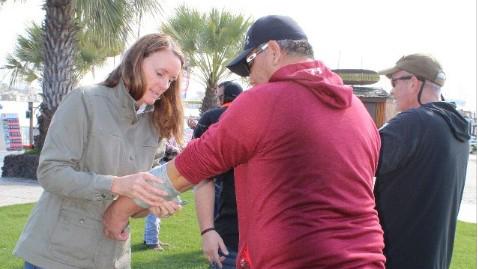 Kate Flanigan Sawyer M.D. practices wrapping a student’s arm during the 2019 MIL Train-the-Trainer Training in San Diego, CA. March 8, 2019. Photo: BIA.