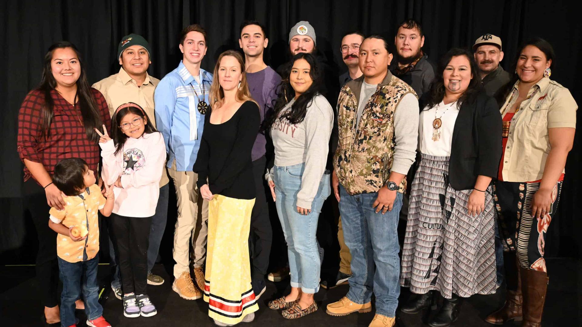 A group of Native American Wildlife Society Conference attendees stands together smiling.